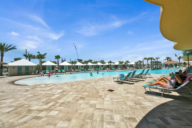 view of swimming pool featuring a patio area