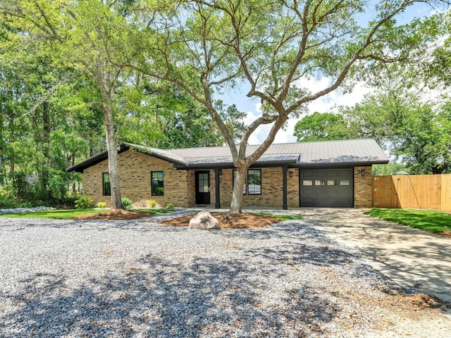 ranch-style house featuring a garage