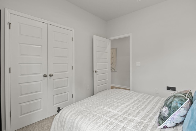 carpeted bedroom featuring a closet