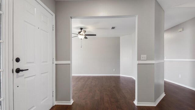 foyer featuring dark hardwood / wood-style flooring and ceiling fan