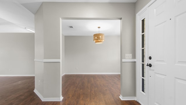 foyer entrance with dark wood-type flooring