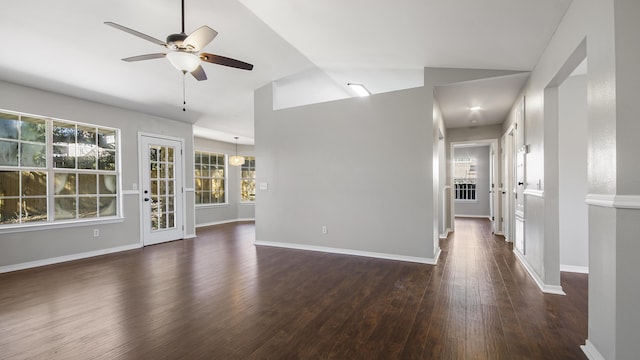 empty room with ceiling fan, dark wood-type flooring, and lofted ceiling