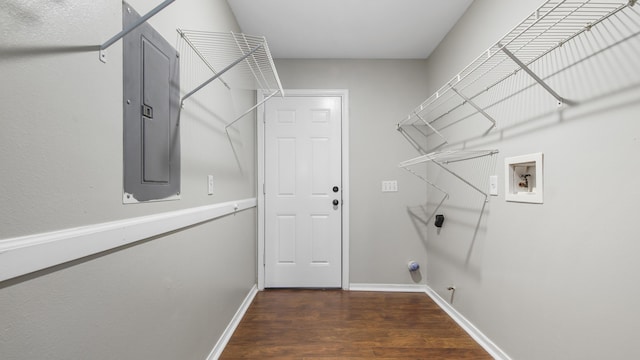 laundry room with electric dryer hookup, electric panel, hookup for a gas dryer, hookup for a washing machine, and dark hardwood / wood-style flooring