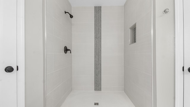 bathroom with tiled shower