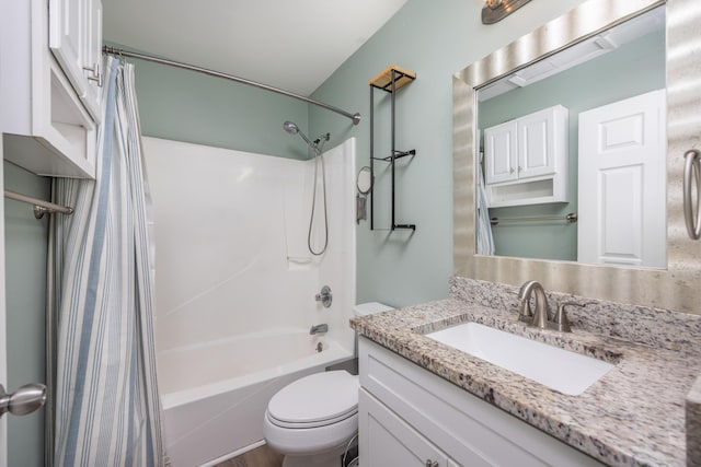 full bathroom with shower / tub combo, vanity, and toilet