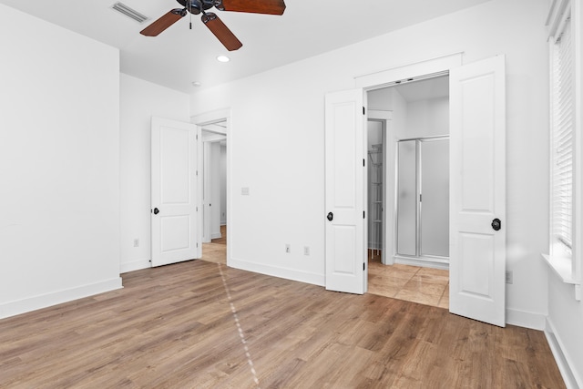 unfurnished bedroom with ceiling fan and wood-type flooring