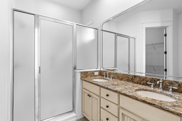 bathroom with vanity and an enclosed shower