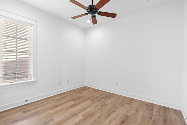 unfurnished room featuring ceiling fan and light hardwood / wood-style floors