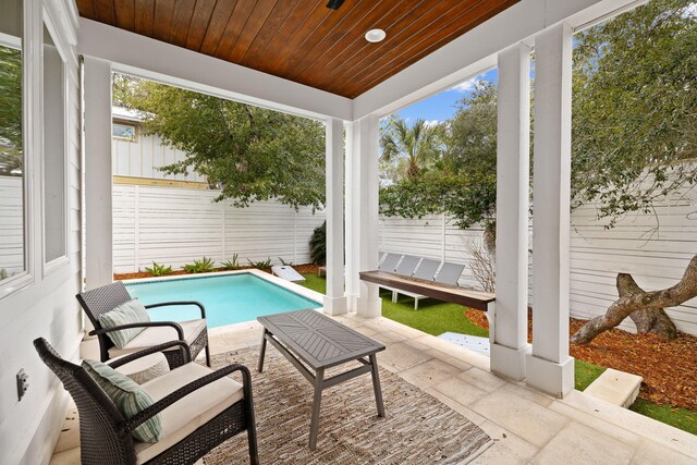 view of swimming pool with a patio area