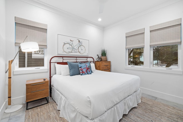 tiled bedroom featuring ceiling fan and ornamental molding