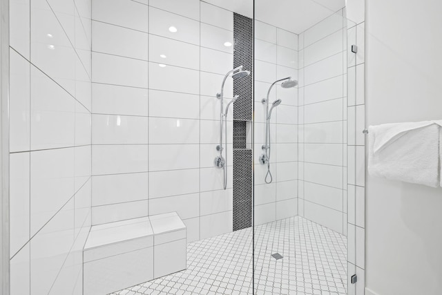 bathroom featuring a tile shower