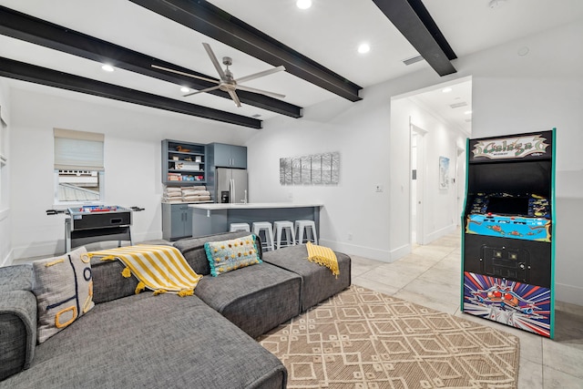 living room featuring ceiling fan, ornamental molding, light tile patterned flooring, and beam ceiling