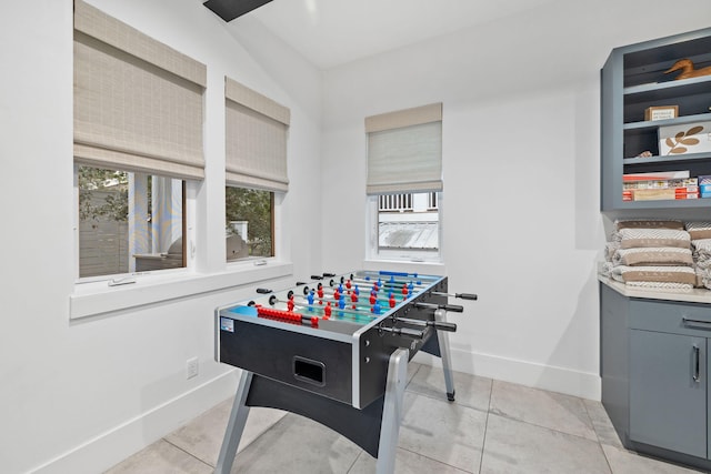 rec room featuring light tile patterned flooring