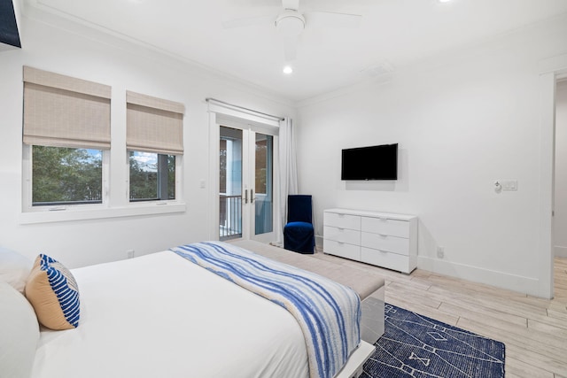 bedroom with crown molding, ceiling fan, and hardwood / wood-style floors