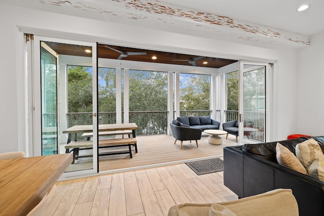 entryway featuring ceiling fan, a healthy amount of sunlight, and light hardwood / wood-style floors