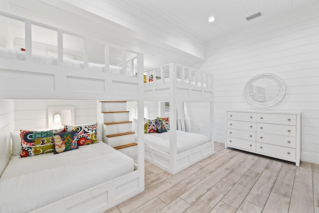 bedroom with wooden walls