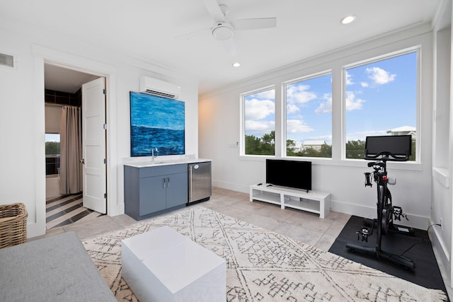 interior space featuring light tile patterned flooring, sink, crown molding, a wall mounted AC, and ceiling fan