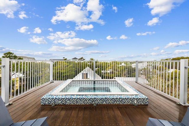 wooden terrace with an outdoor hot tub