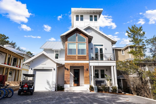 view of front of house with a balcony and a garage