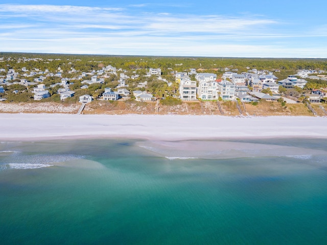 bird's eye view featuring a view of the beach and a water view