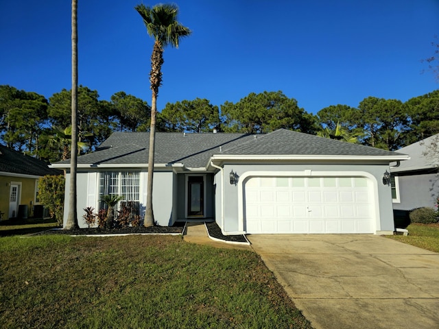 ranch-style home with a garage and a front lawn