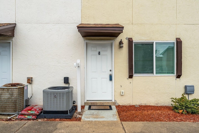 doorway to property featuring central AC