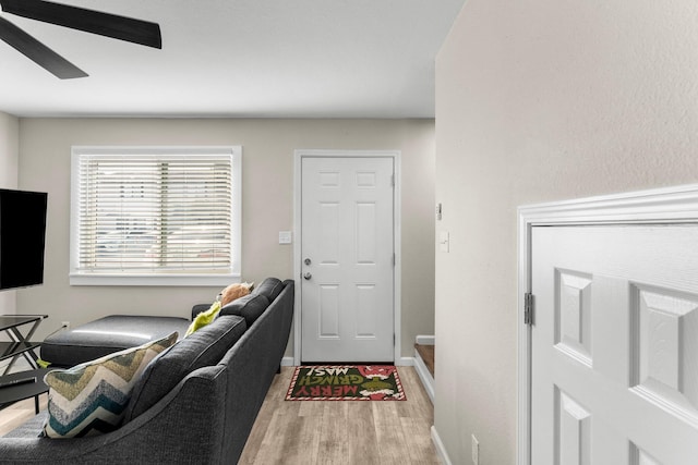 interior space with ceiling fan and light wood-type flooring