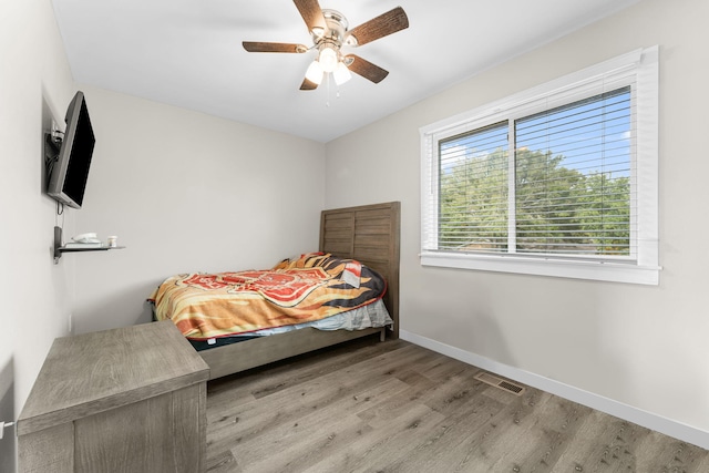 bedroom featuring ceiling fan and light hardwood / wood-style flooring