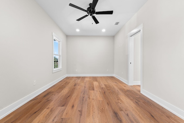 unfurnished room featuring ceiling fan and light hardwood / wood-style floors