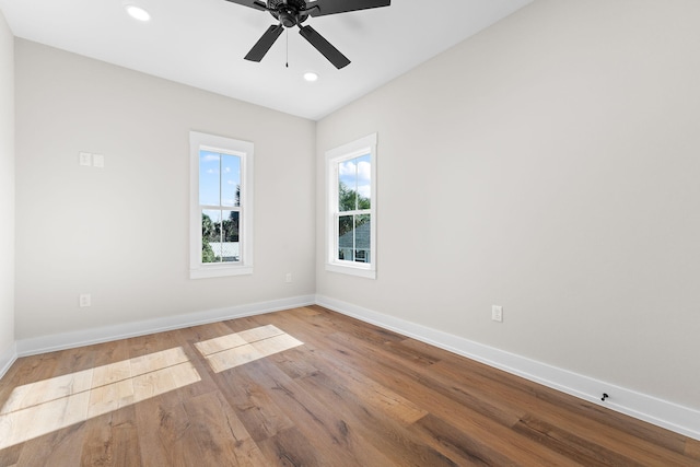 unfurnished room with ceiling fan and light hardwood / wood-style flooring