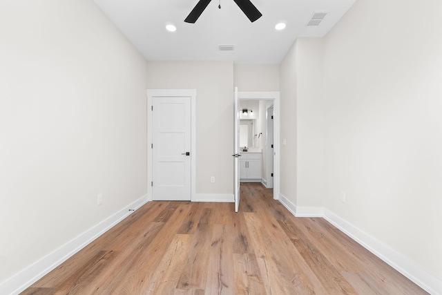 unfurnished bedroom featuring ceiling fan and light wood-type flooring