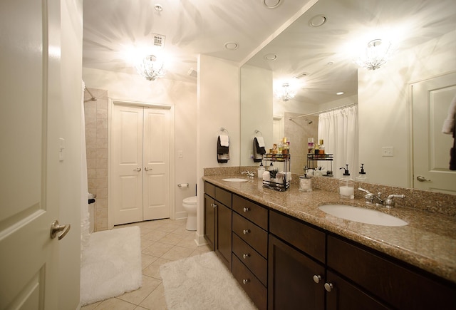 bathroom with tile patterned floors, vanity, toilet, and a shower with shower curtain