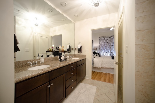 bathroom with tile patterned flooring and vanity