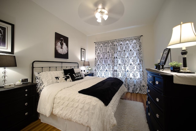 bedroom featuring hardwood / wood-style floors and ceiling fan