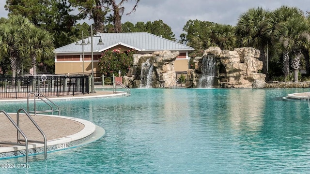 view of swimming pool featuring pool water feature