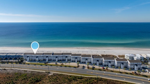 aerial view featuring a water view and a beach view