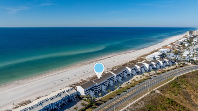 aerial view featuring a water view and a beach view