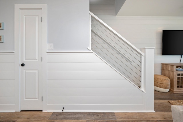 stairway featuring hardwood / wood-style floors