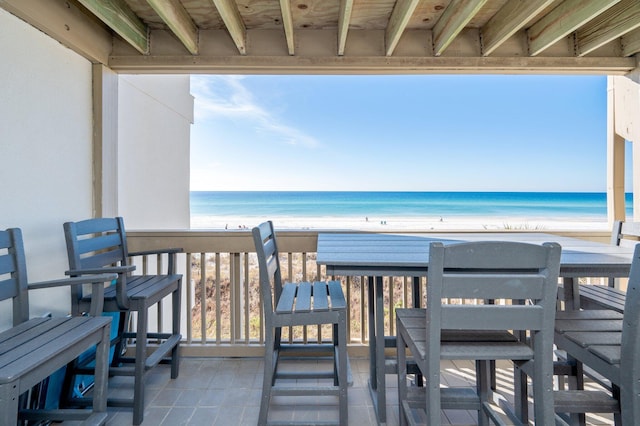 exterior space featuring a view of the beach and a water view