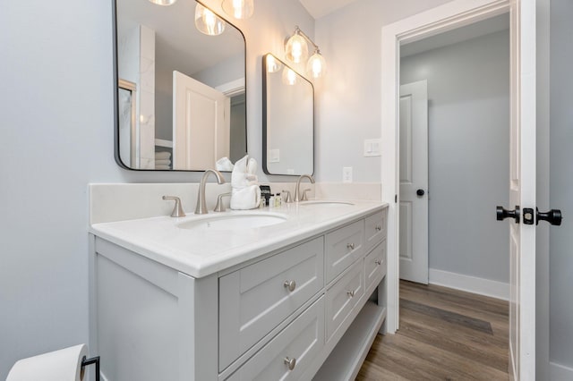 bathroom with vanity and hardwood / wood-style flooring