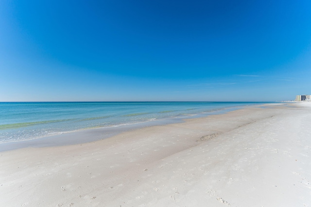 view of water feature with a beach view