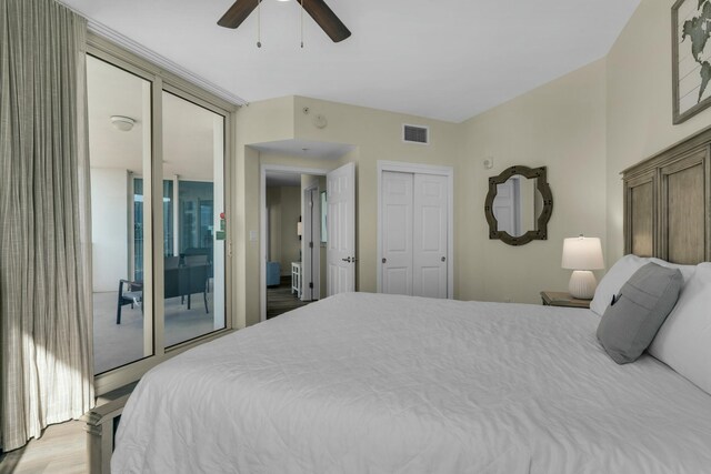 bedroom with ceiling fan, access to exterior, and a closet