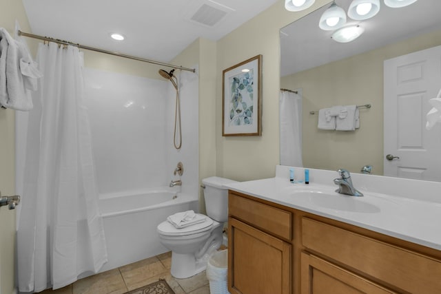 full bathroom featuring tile patterned flooring, shower / bath combination with curtain, vanity, and toilet