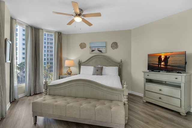 bedroom featuring wood-type flooring and ceiling fan