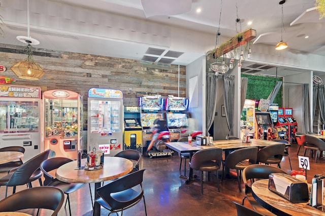 dining area featuring wooden walls