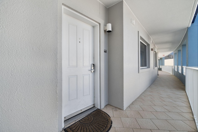 doorway to property with covered porch