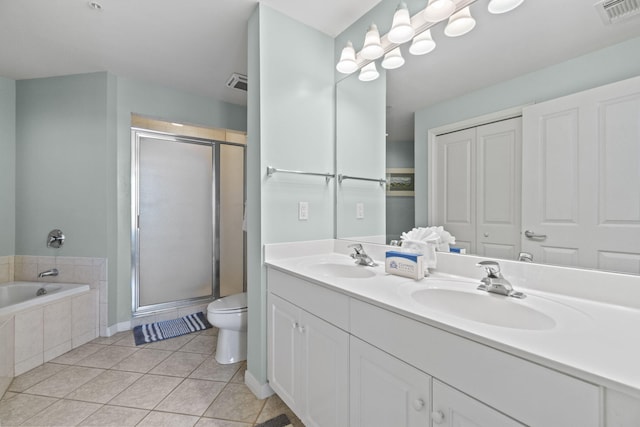 full bathroom with toilet, shower with separate bathtub, vanity, and tile patterned floors