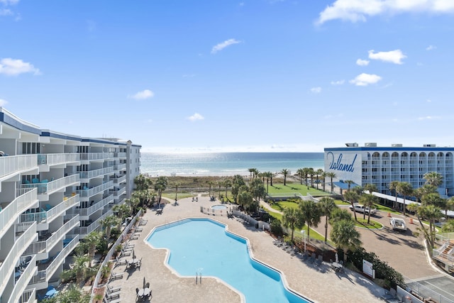 view of pool with a water view