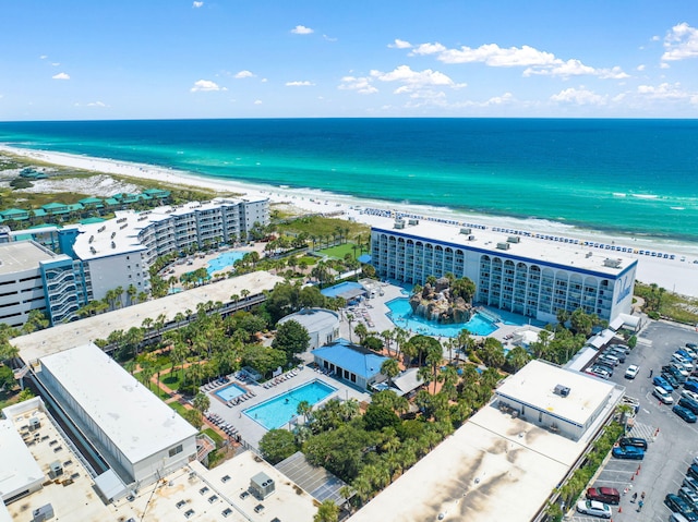 birds eye view of property featuring a water view and a view of the beach