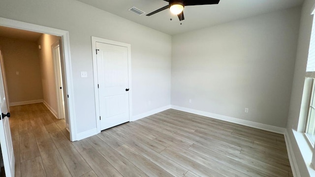 2718 Louis Cir, Crestview, FL 32536 - unfurnished bedroom featuring light wood-type flooring, ceiling fan, baseboards, and visible vents